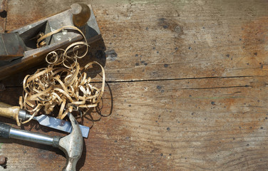  wooden table for carpenter tools with sawdust.copy space