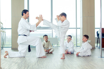 young, beautiful, successful multi ethical kids in karate position © satyrenko