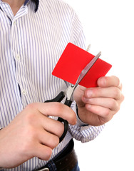 Person cutting a Credit Card