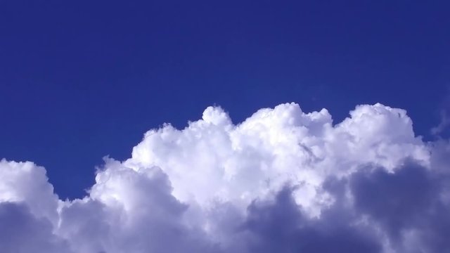 Rolling clouds in the blue sky, timelapse full HD video