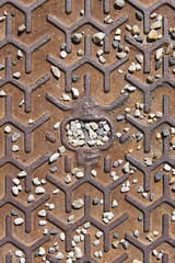 rusty old metallic textured surface with a lots of small pebbles