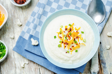 smashed cauliflower with crispy bacon, cheddar and green onions