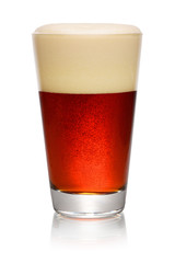 Glass of dark beer on white