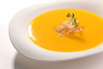 Yellow soup with croutons