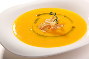 Yellow soup with croutons
