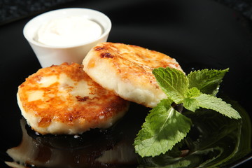 cheese with Mint on black background