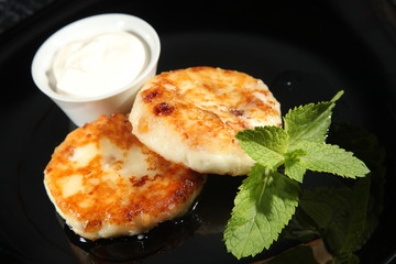 cheese with Mint on black background