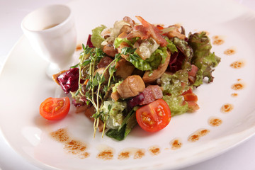 Salad with meat and pesto sauce