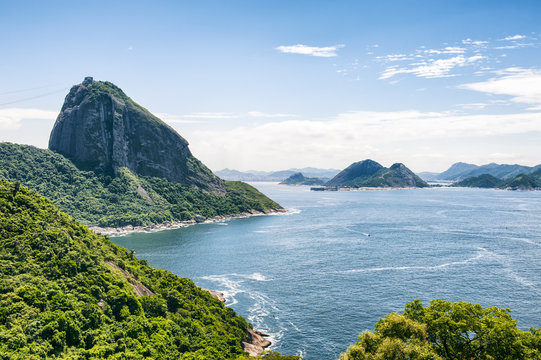Scenic green view of Sugarloaf Mountain standing above Guanabara Bay in Rio de Janeiro, Brazil
