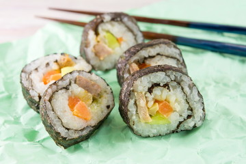 Sushi rolls and chopsticks