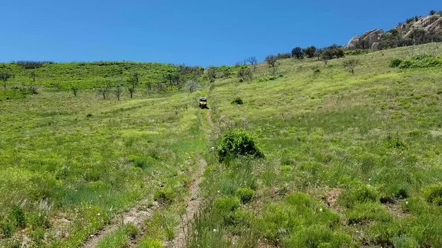 4x4 recreation vehicle down steep green mountain trail. Uinta National Forest. Sanpitch Mountain in central Utah. Beautiful forest, trails, campgrounds, rock climbing and hiking.