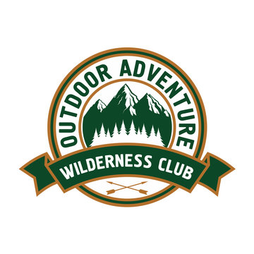 Outdoor adventure badge with mountain landscape