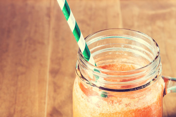 Mason jar with carrot juice smoothie