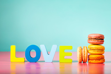 Stack of macarons on pastel background