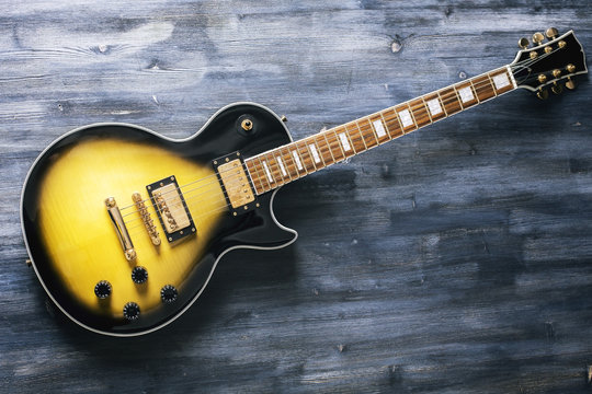 Electric guitar on wooden surface