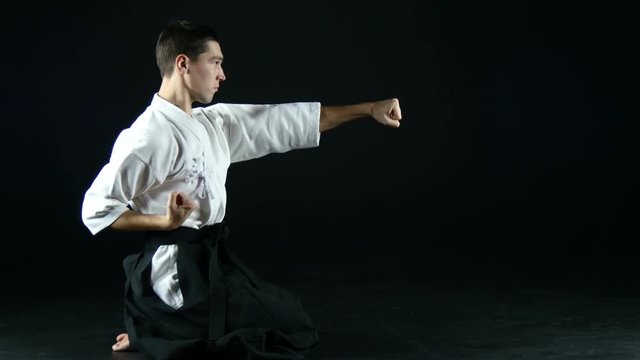  sportsman in kimono practice  punches