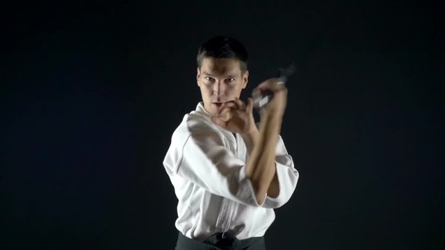 Aikido training. Practicing with the sword, slow motion