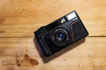 Old Vintage camera on wooden background