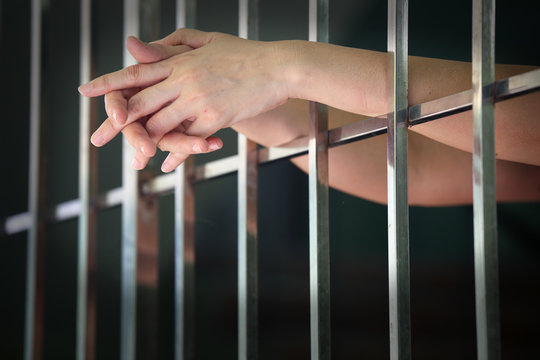 hands of prisoner in jail