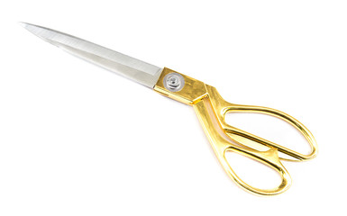 A gold tailoring scissors isolated on white background