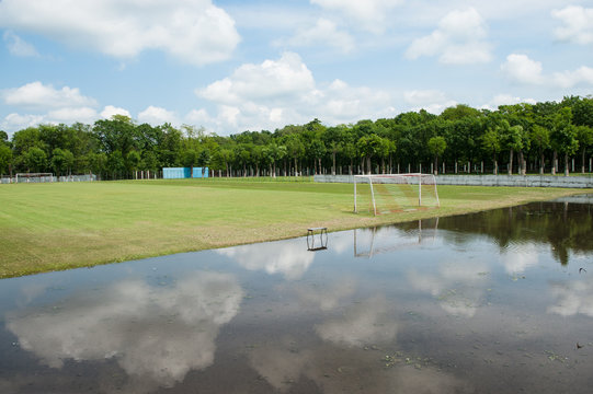 football field, flood, puddle, cloud, natural disaster, climate change