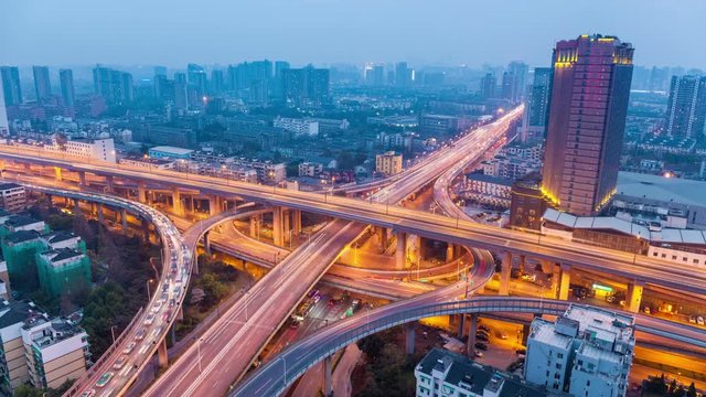 city highway overpass in hangzhou ,  time lapse of bright lights and traffic at dusk to night