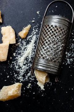 Parmesan cheese with a grater