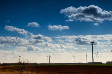 Fototapeta premium Windmill, blue sky and clouds