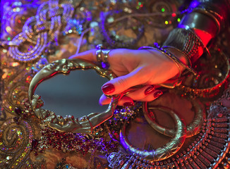 Fototapeta na wymiar Golden Oriental Jewelry and Accessories: Female Hands with India