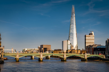 London’s south bank seen from the Millennium Bridge with London Bridge, Tower Bridge and river Thames at golden hour