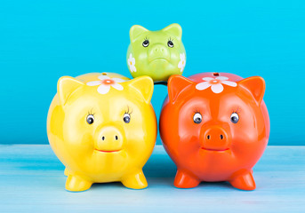 Pig piggy bank Pyramid on a blue background. Finance concept.