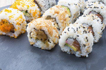 Sushi rolls on a slate plate