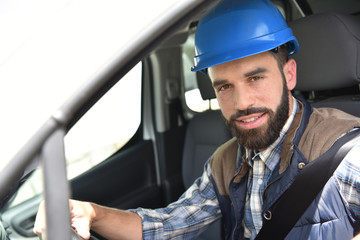 Technician sitting in vehicle