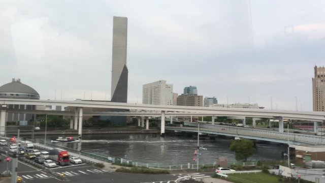 TOKYO -MAY 2016: Odaiba skyline from moving subway. Tokyo attracts 5 million foreign people every year