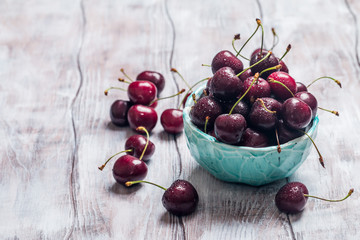Cherries in a bowl with water drops 