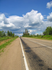 The road stretches into the distance, trail braking on the road