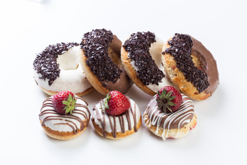 various donuts on white background