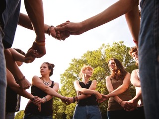 large group of friends together in a park having fun