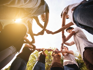 large group of friends together in a park having fun