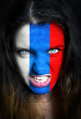 Portrait of a woman with the flag of the Russia painted on her face