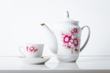 Cup of tea with teapot in vintage style