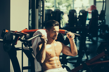 muscular man training in gym