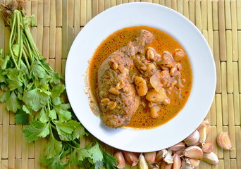 chicken leg spicy and sweet curry on dish