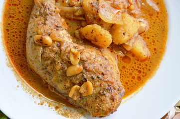 chicken leg Mussaman curry on plate