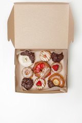 box of fresh donuts isolated on white