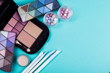 cosmetics on blue workplace. Top view