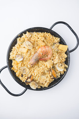 traditional spanish rice - paella isolated on white background