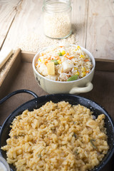 Different rice dishes (paella with vegetables, tomato and rice p