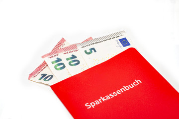Sparbuch mit rausguckenden Geldscheinen 