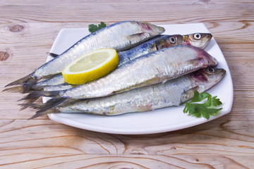 fish,  dish of sardines on wooden background